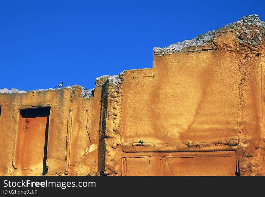 Contrast blue and ocher in a building with a dove. Contrast blue and ocher in a building with a dove