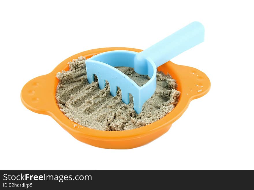 Sieve with sand and rake