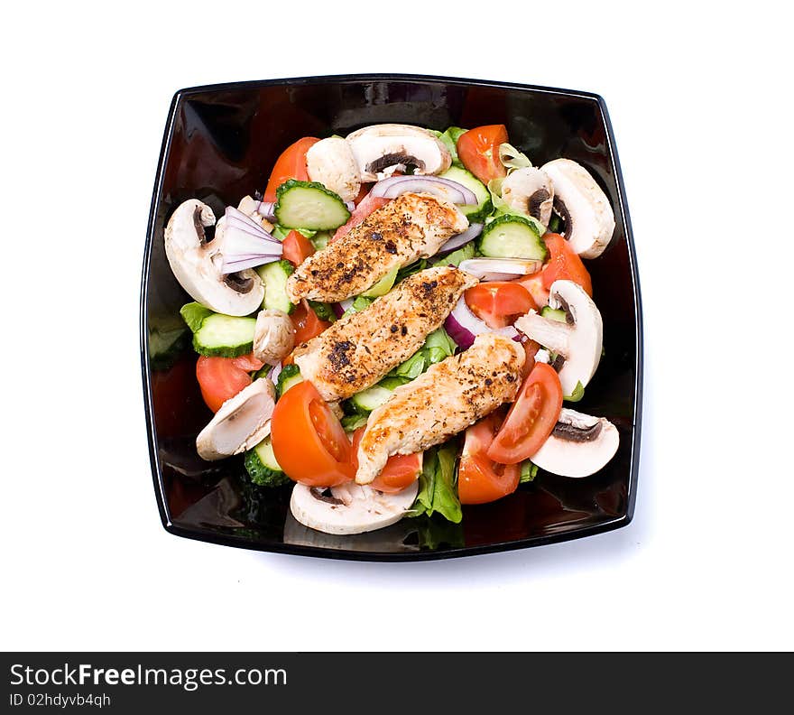 Bowl of chicken salad on white