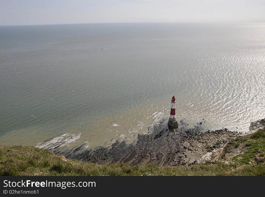 Renowned suicide spot and scenic view, the red and white lighthouse on the Sussex coast near Eastbourne. Renowned suicide spot and scenic view, the red and white lighthouse on the Sussex coast near Eastbourne