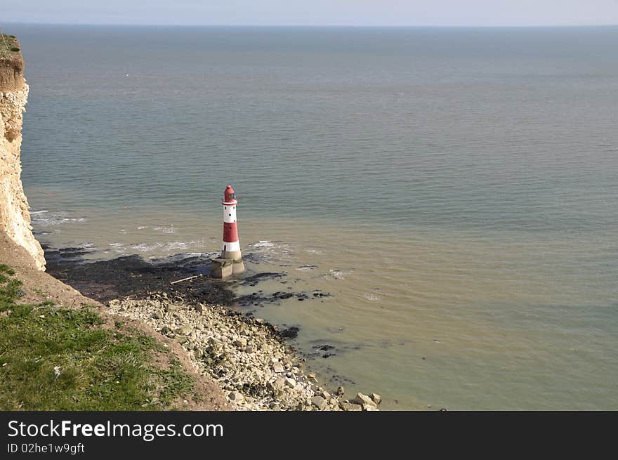 Renowned suicide spot and scenic view, the red and white lighthouse on the Sussex coast near Eastbourne. Renowned suicide spot and scenic view, the red and white lighthouse on the Sussex coast near Eastbourne