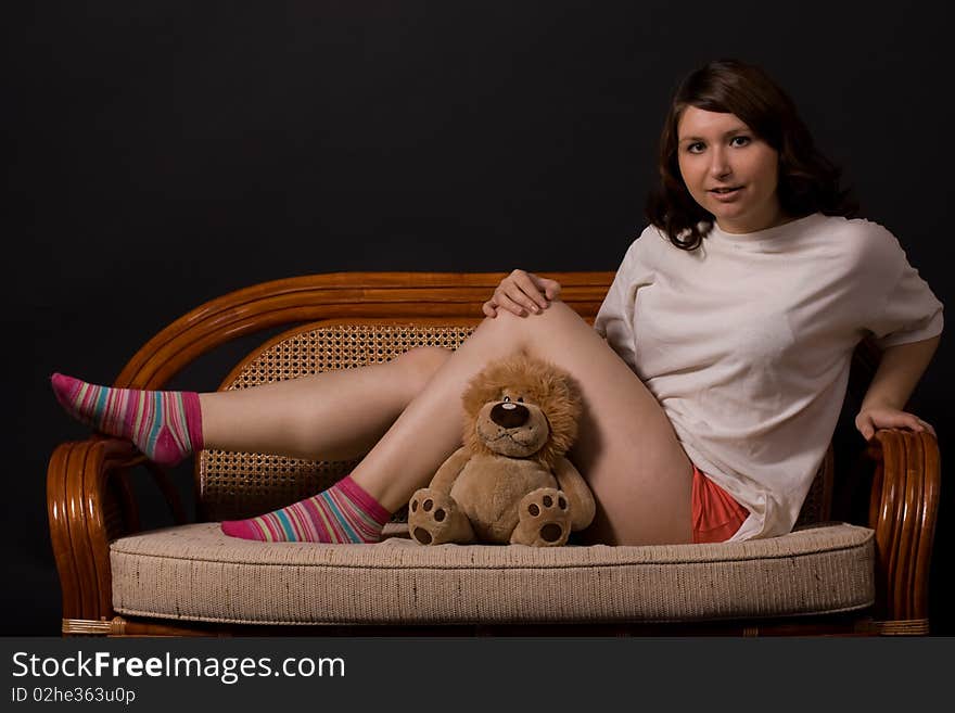 A girl holds a yellow toy-lion. A girl holds a yellow toy-lion