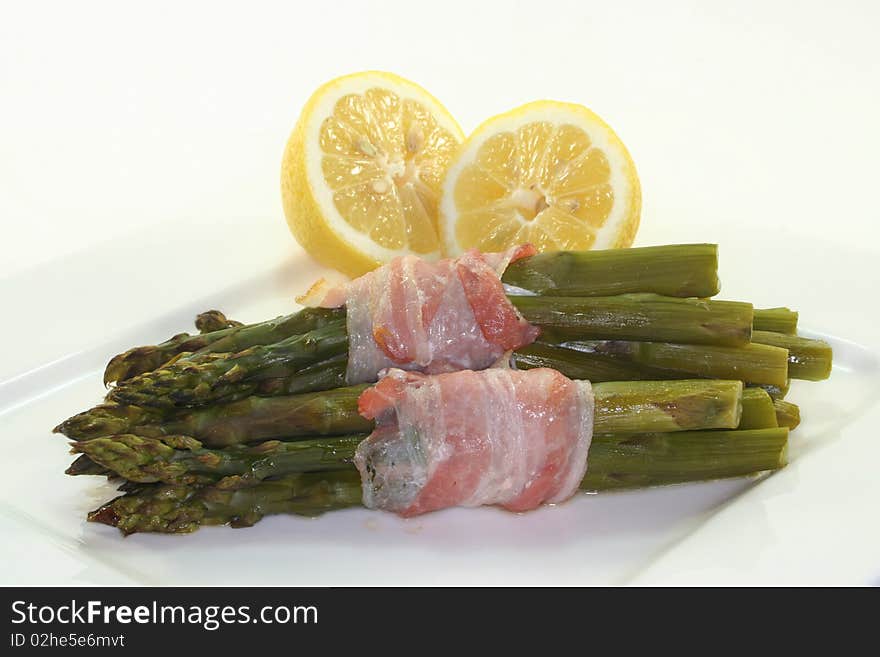 Green asparagus with ham in the oven. Green asparagus with ham in the oven