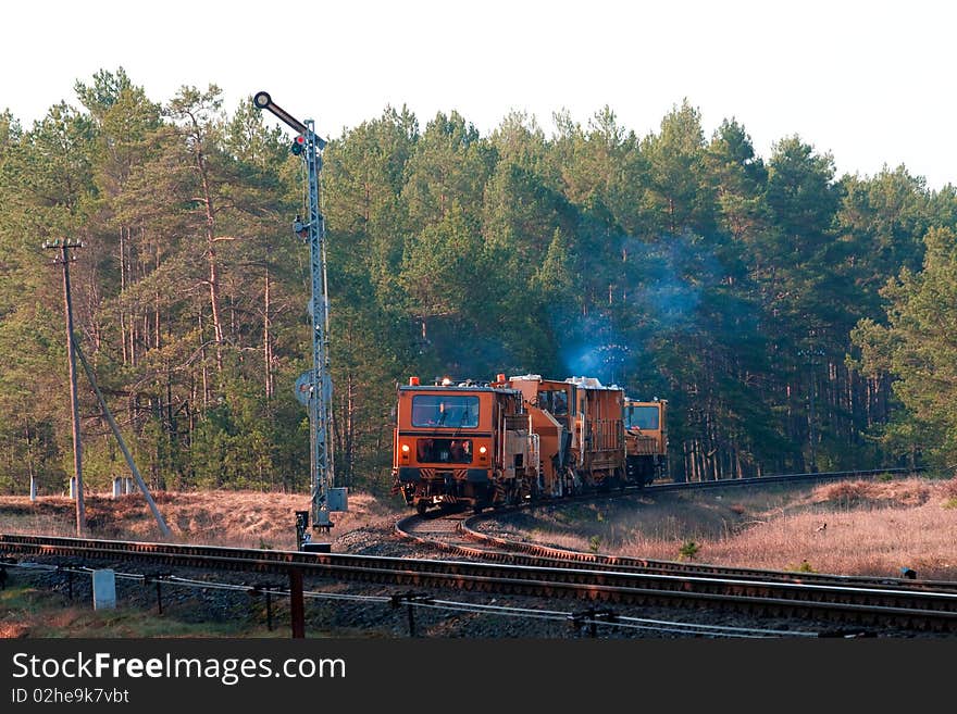 Railway heavy duty machines train entering the station