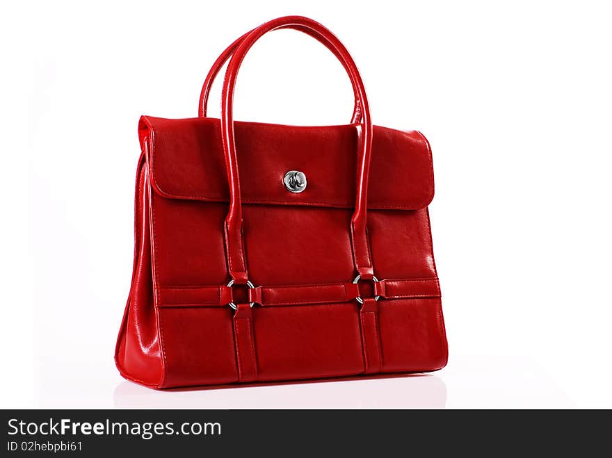 Red handbag in the studio on a white background. Red handbag in the studio on a white background.