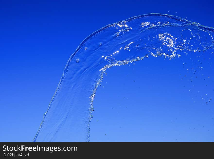 Bright splash of water against the blue sky