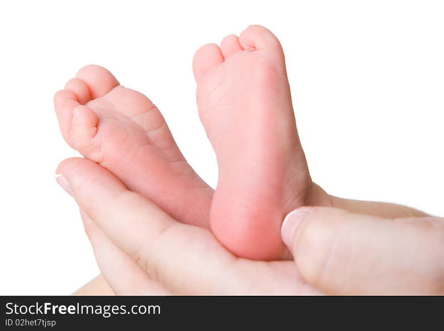 Heels of the baby in hands of mother. Heels of the baby in hands of mother