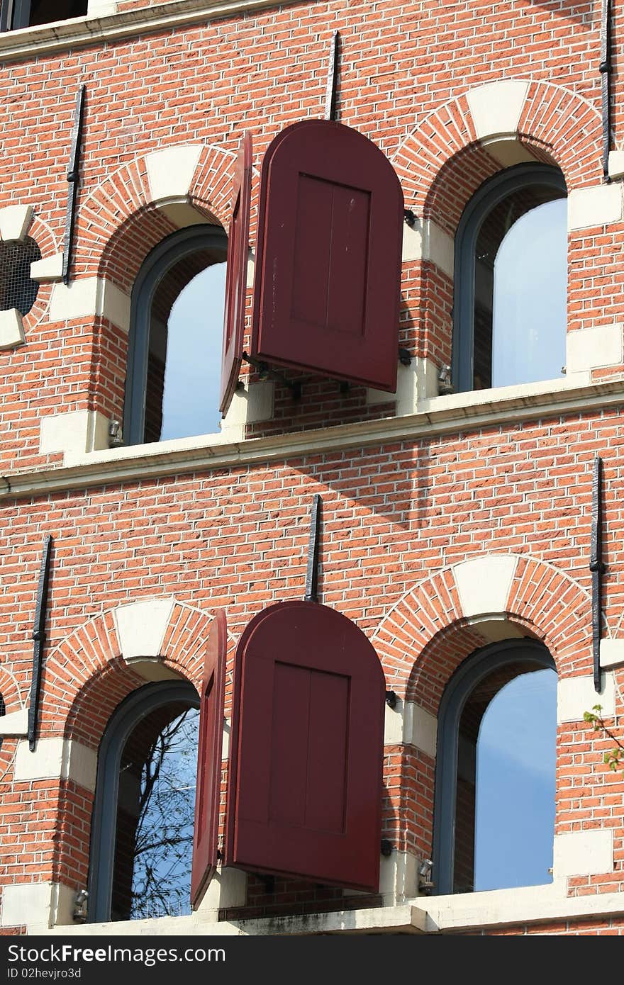 Historic dutch facade, windows with shutters