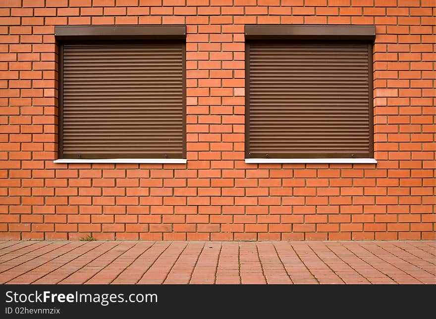 Wall From A Red Brick And By Windows