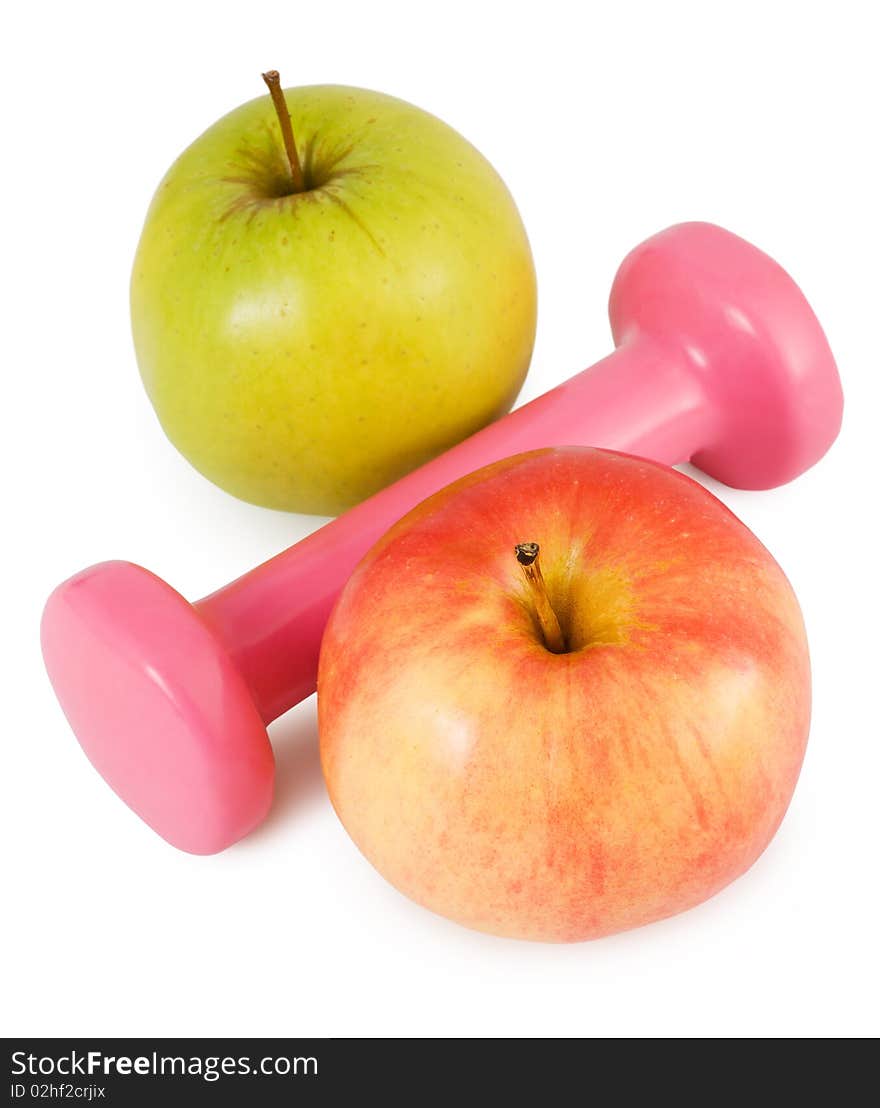 Pink dumbbells and two apples on a white background in percent shape. Pink dumbbells and two apples on a white background in percent shape