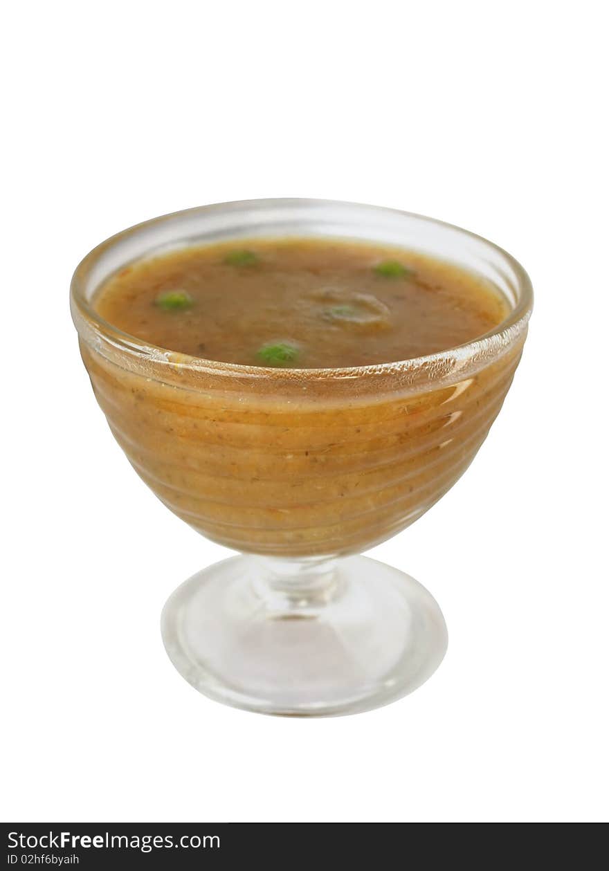 Vegetable soup puree in a glass dish on a white background