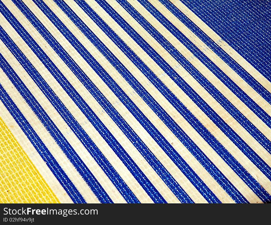 Blue striped plastic surface texture suitable as background