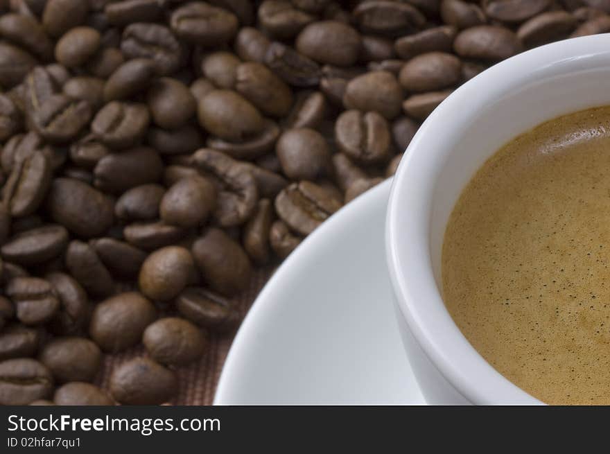 Coffee cup closeup with coffee beans. Coffee cup closeup with coffee beans