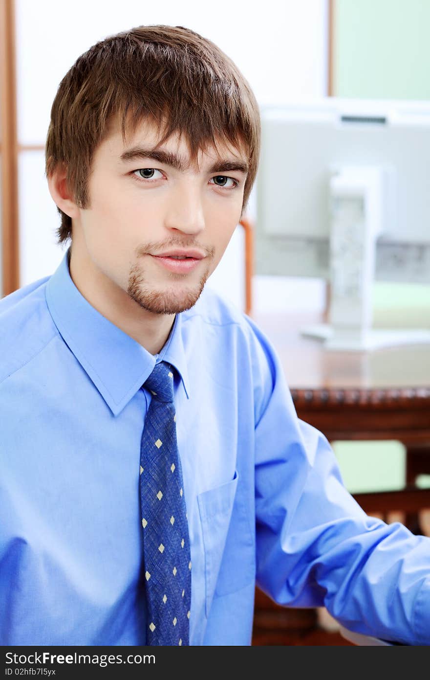 Handsome young businessman working at the office. Handsome young businessman working at the office.