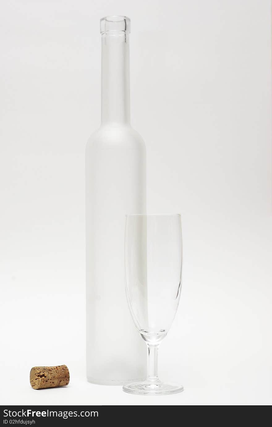 Empty wine bottle and slim glass. Empty wine bottle and slim glass