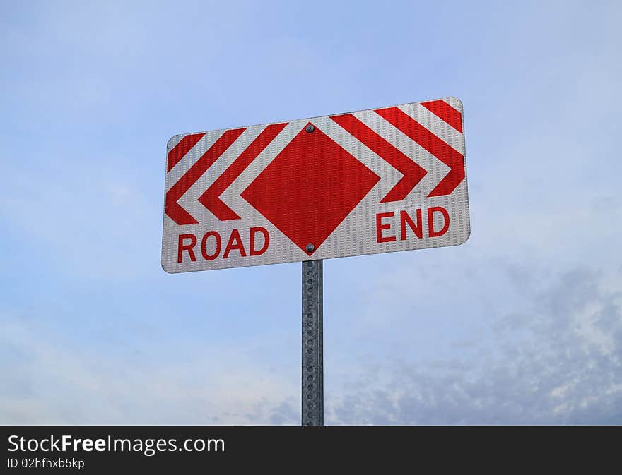 Road End Sign with sky in background