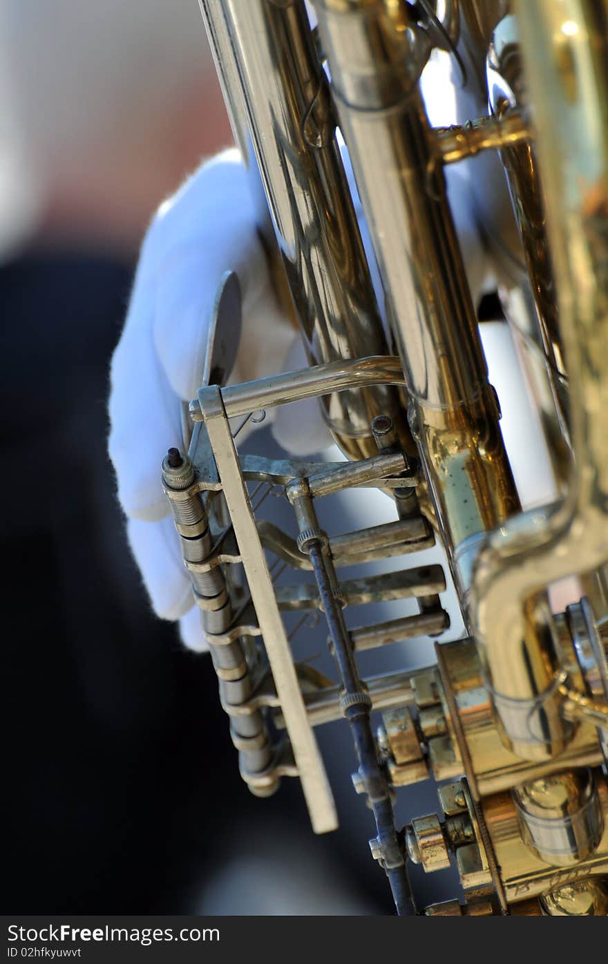 Detail of a musician with brass instrument