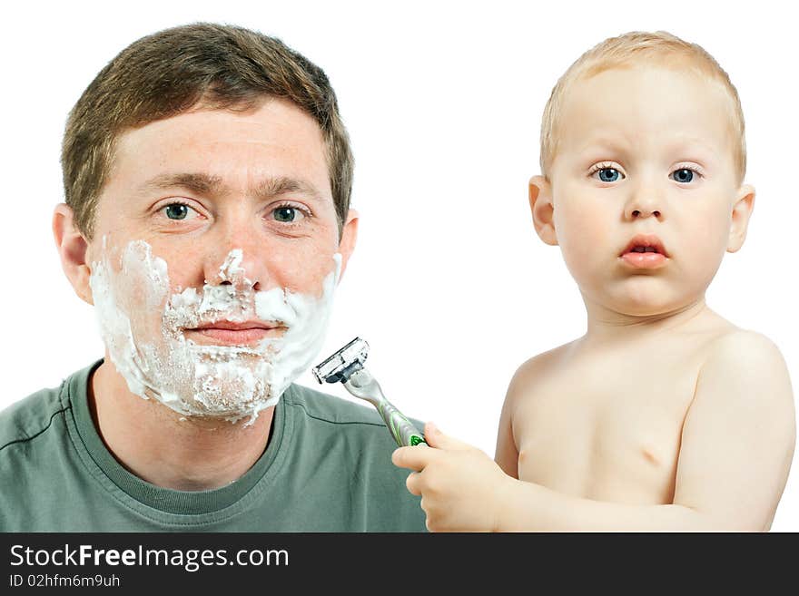 Cute little boy shaving his father - on white background. Cute little boy shaving his father - on white background