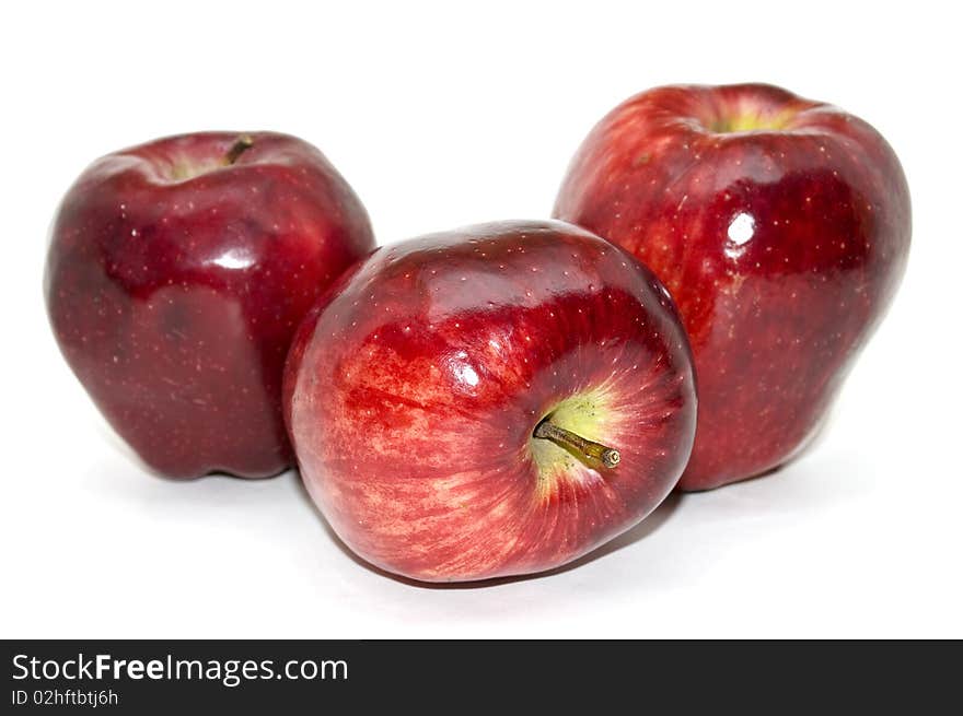 Beautiful red apples isolated on a white background. Beautiful red apples isolated on a white background.