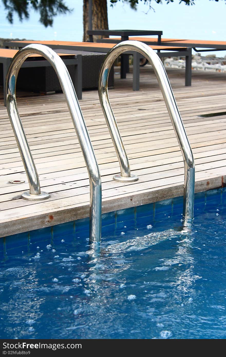 Luxury hotel poolside and ladder