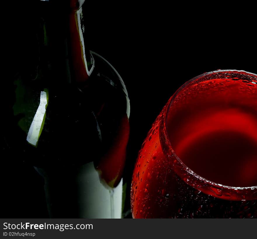 Red wine on black background