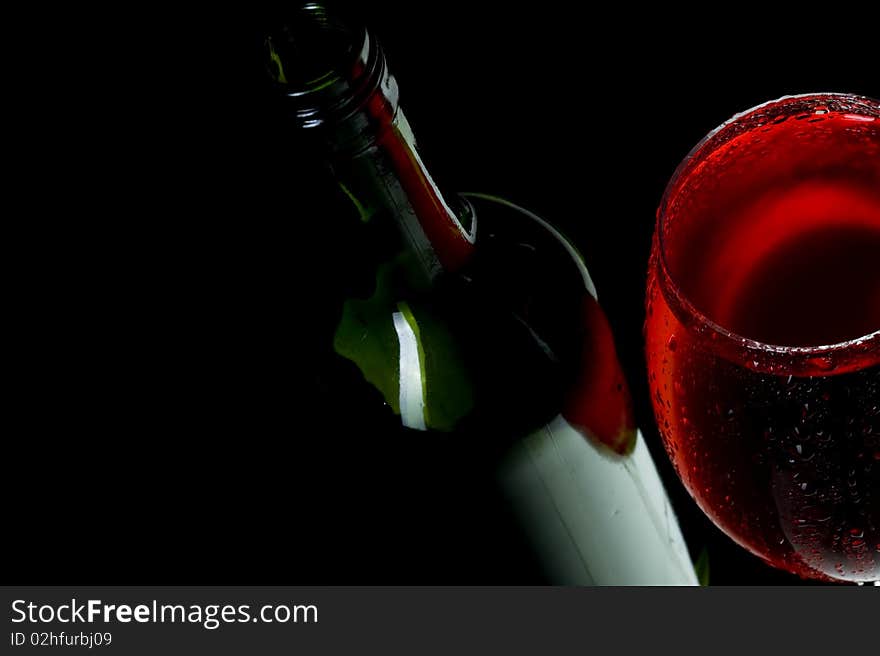 Red wine on black background