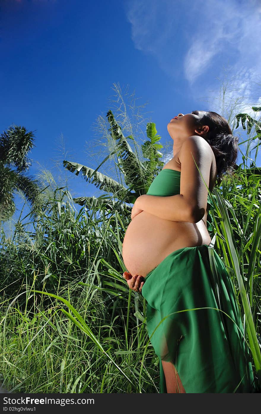 Woman in the jungle is heavily pregnant. Woman in the jungle is heavily pregnant