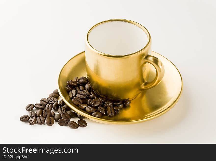 Empty coffee cup with beans on white. Empty coffee cup with beans on white