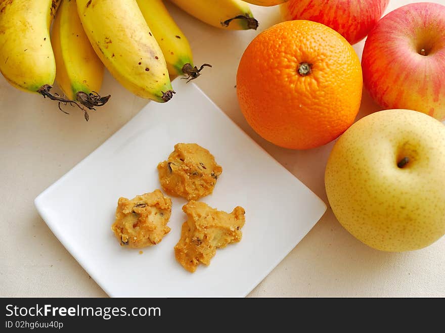 Contrast of fruits and unhealthy snack