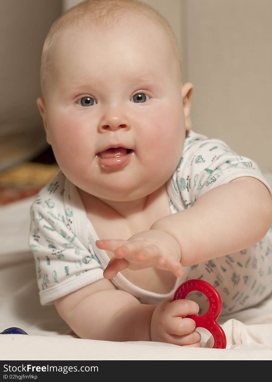 Portrait of a baby girl (9 months) at home