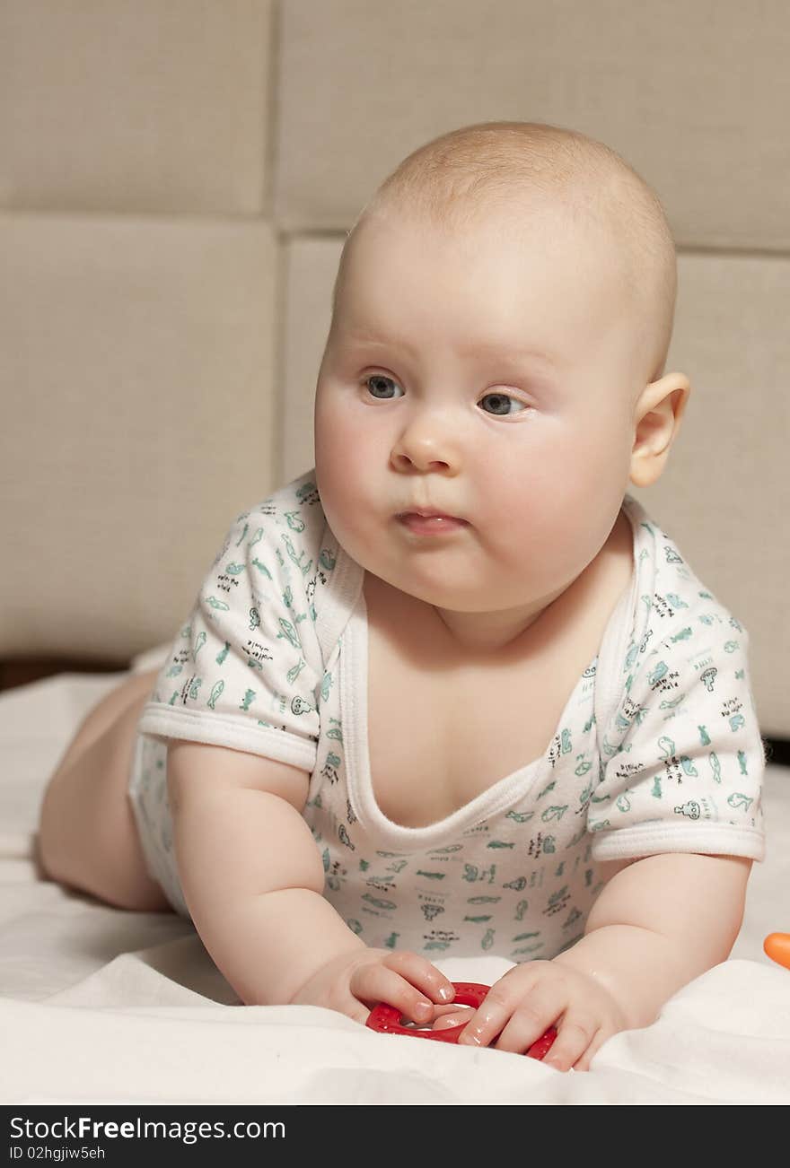 Portrait of a baby girl (7 months) at home