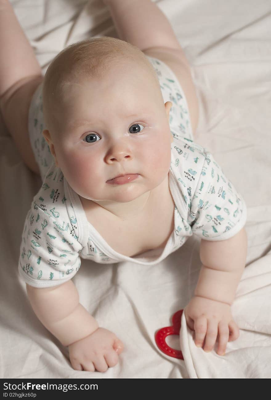 Portrait of a baby girl (9 months) at home, overhead view