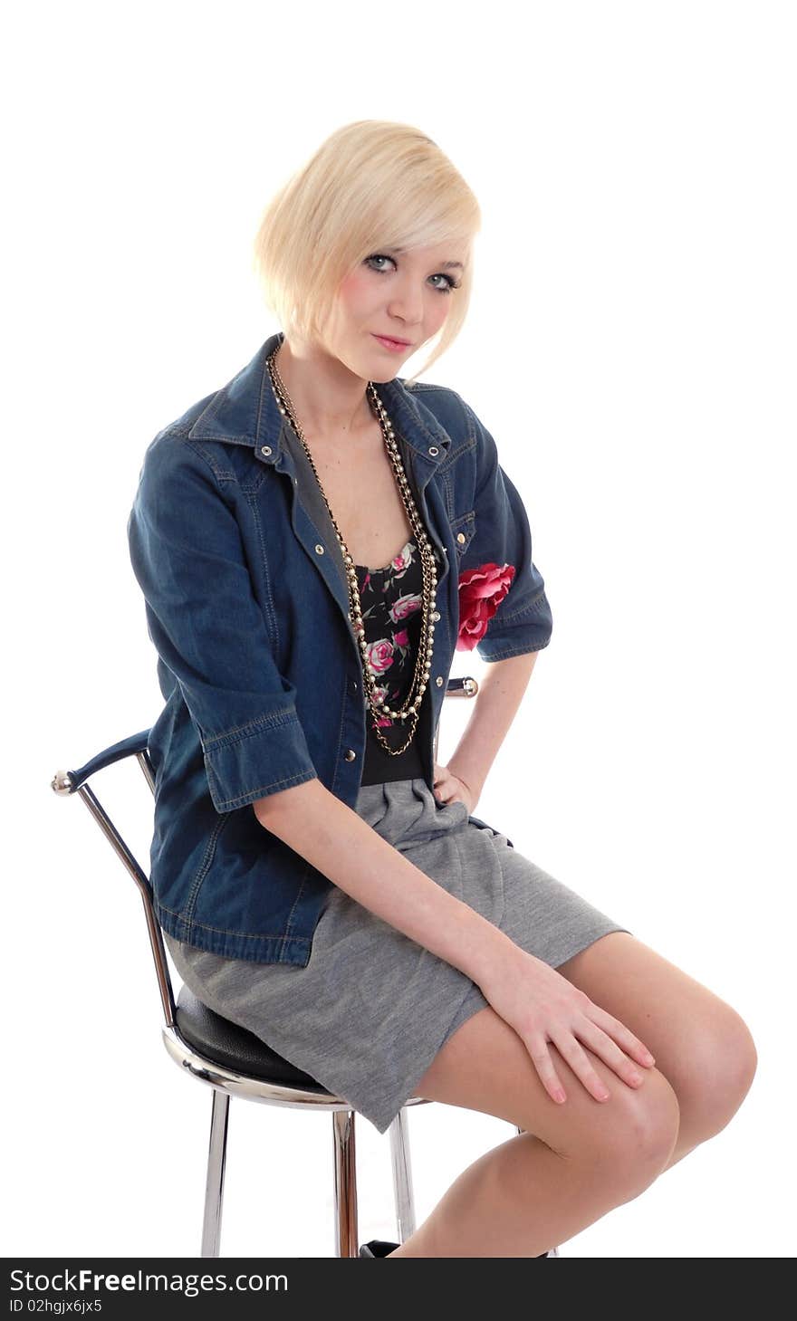 Photograph of pretty blond girl on stool isolated. Photograph of pretty blond girl on stool isolated