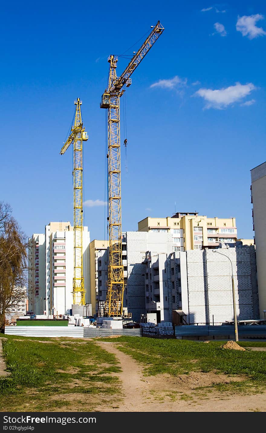 The yellow cranes a sunny day spending building of the new house