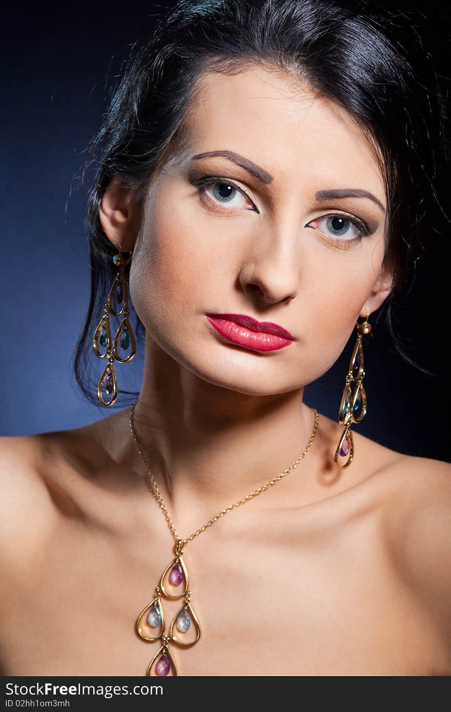 Portrait of elegant beautiful woman wearing jewelry.