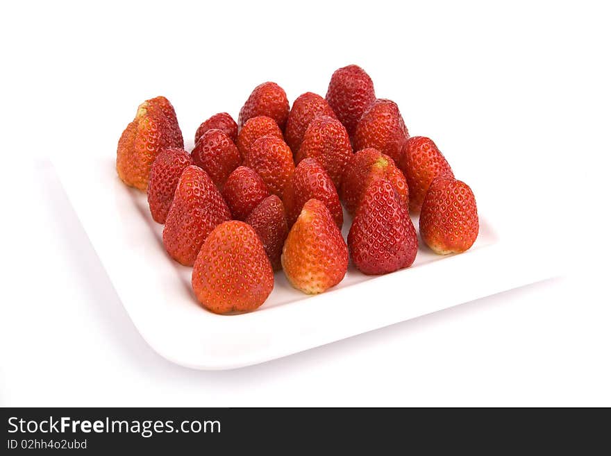 Strawberries on a plate isolated with white background