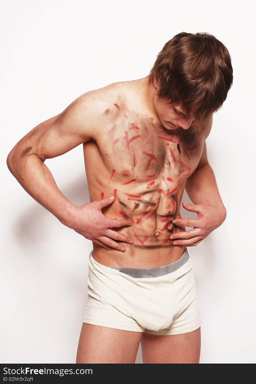 Muscled male model posing in studio. Muscled male model posing in studio