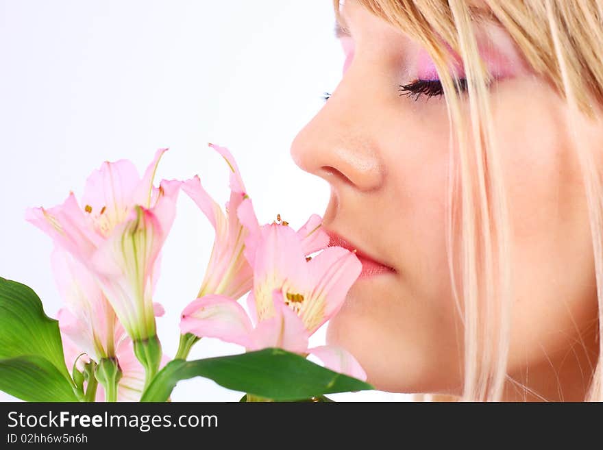 Portrait of a woman holding pink flowers