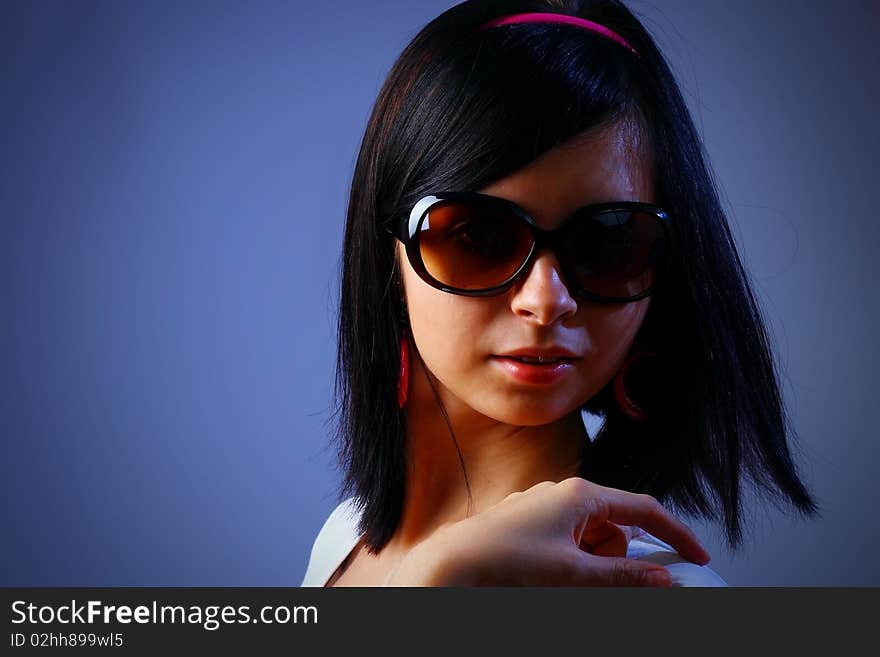 Sexy young woman dancing with sunglasses. Sexy young woman dancing with sunglasses