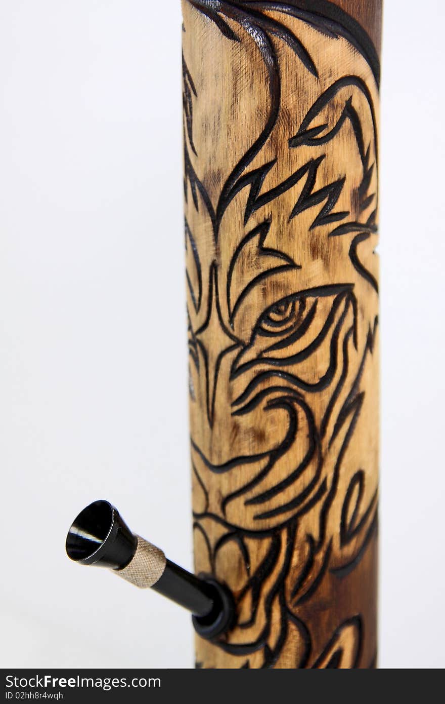 Tiger hand crafted bamboo bong. Tobacco bamboo water pipe. close up. Tiger hand crafted bamboo bong. Tobacco bamboo water pipe. close up