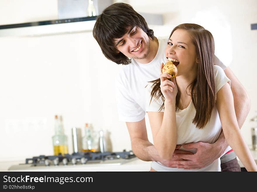 Nice girl with pear and boy with smile. Nice girl with pear and boy with smile