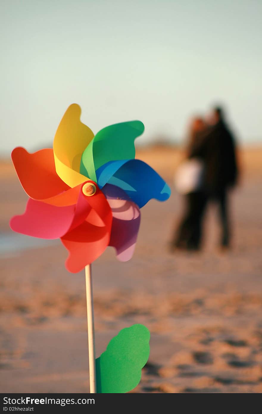 Windmill on the beach - couple in love