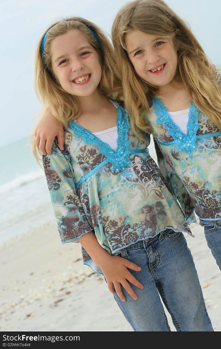 Happy sisters on the beach