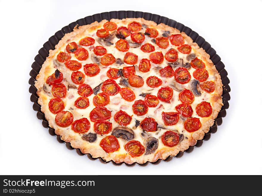 Ham and tomato tart over white background