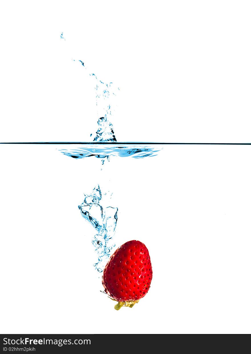 Fresh strawberry splash in water