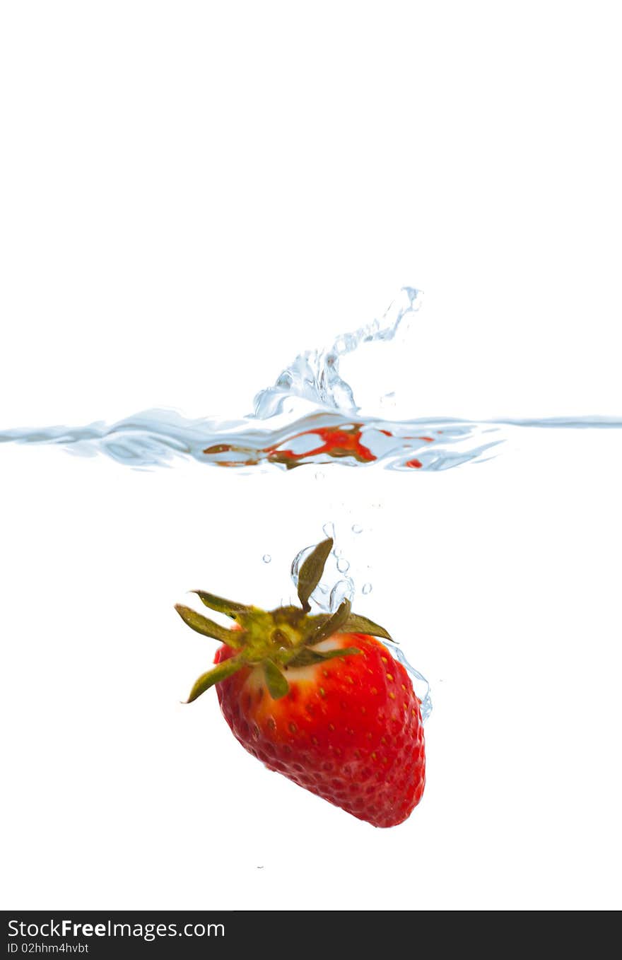 Fresh strawberry splash in water