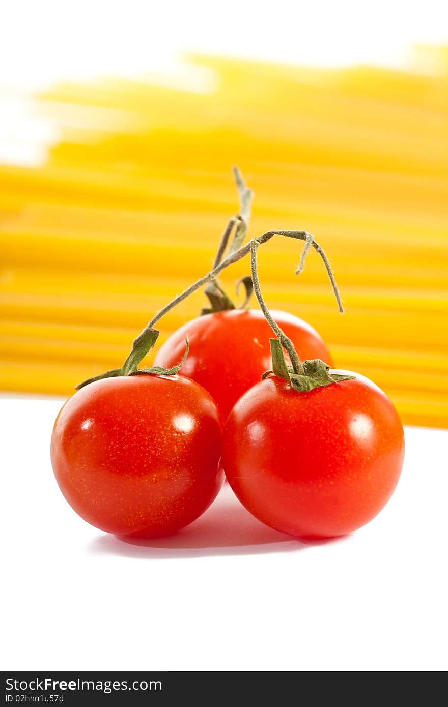 Tomatoes  and pasta isolated on white. Tomatoes  and pasta isolated on white