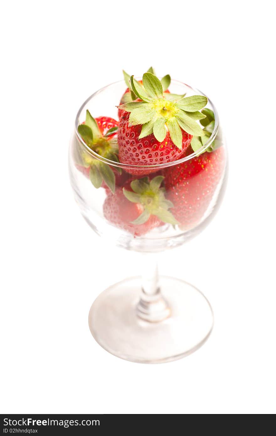 Strawberries in a glass on white background