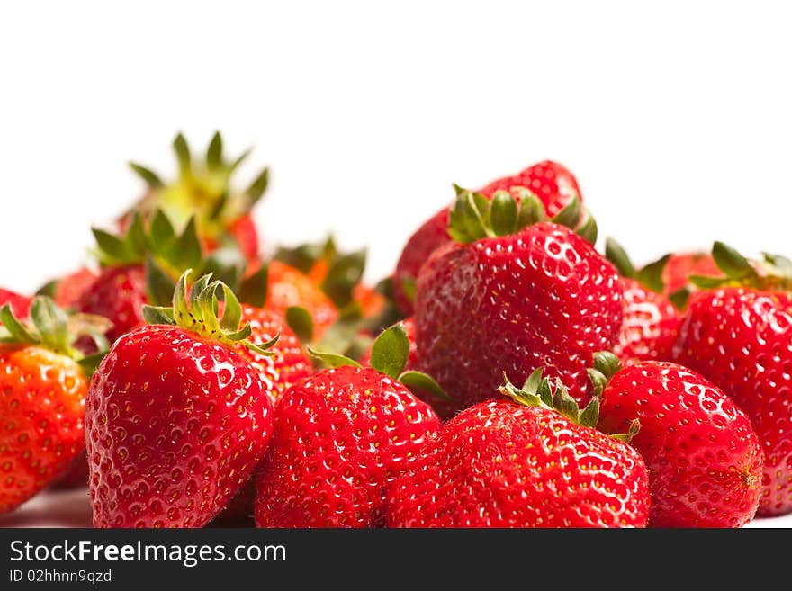 Strawberries in a glass on white background