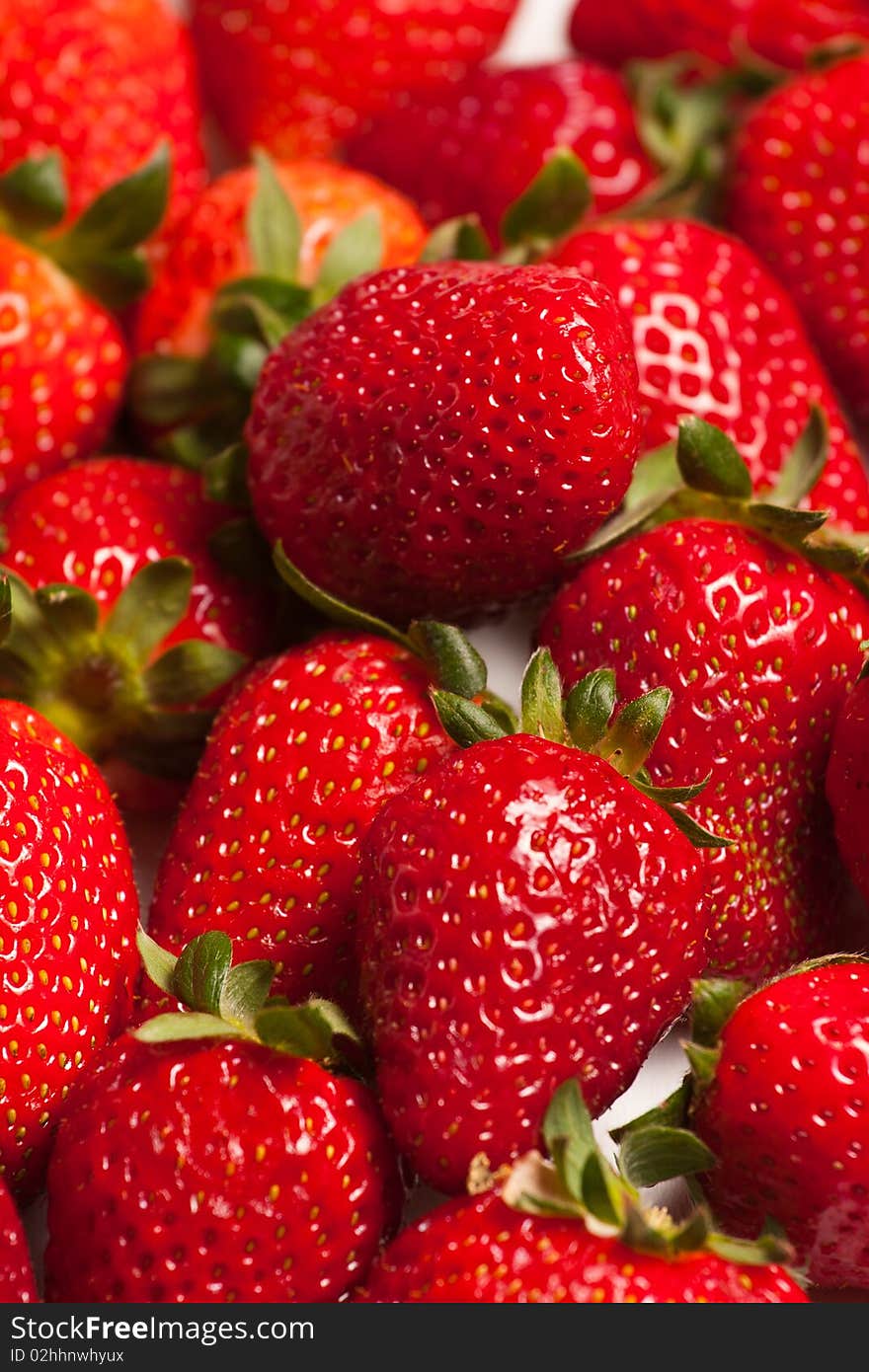 Strawberries in a glass on white background